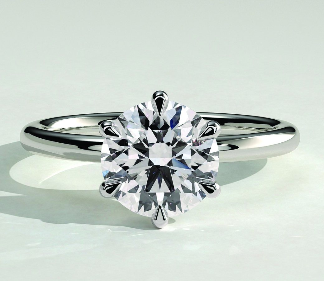 Solitaire engagement ring by SHER.